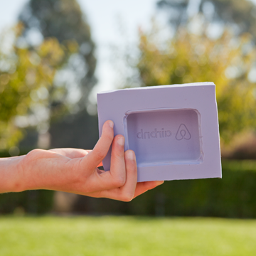 a hand holding a finished soap mold